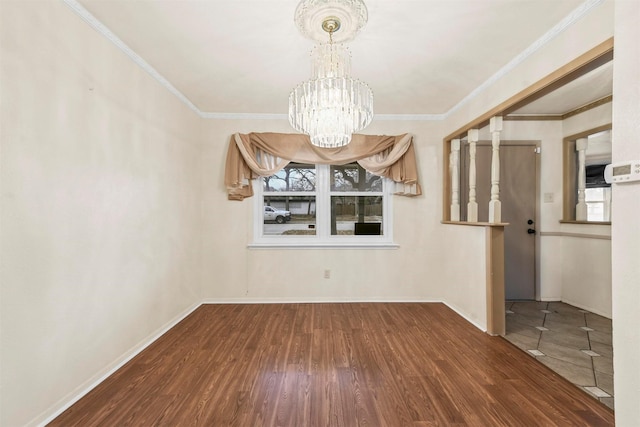 unfurnished dining area featuring ornamental molding, a wealth of natural light, a chandelier, and wood finished floors