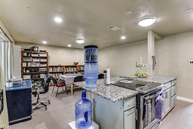 kitchen featuring light stone counters, recessed lighting, concrete floors, visible vents, and stainless steel electric range oven