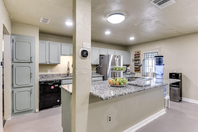 kitchen featuring black dishwasher, finished concrete flooring, visible vents, and freestanding refrigerator