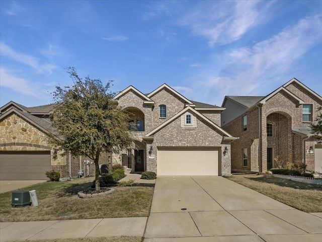 traditional home featuring concrete driveway, brick siding, and an attached garage