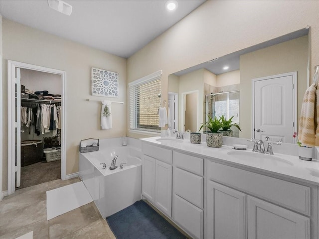 full bath featuring a stall shower, a garden tub, a sink, and double vanity