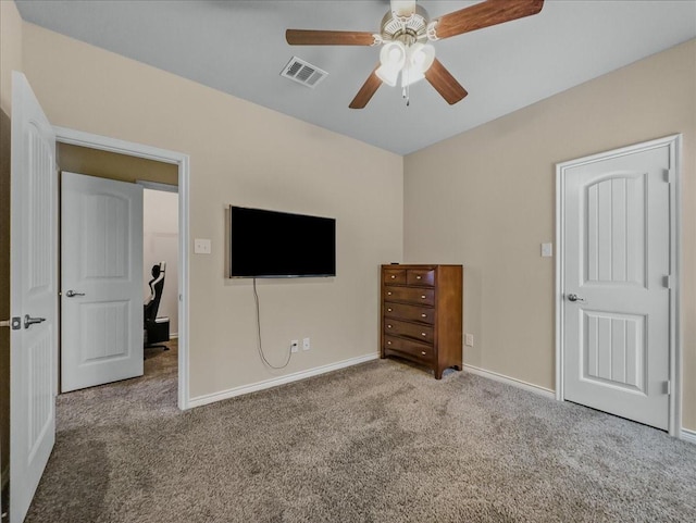 unfurnished bedroom with ceiling fan, carpet floors, visible vents, and baseboards