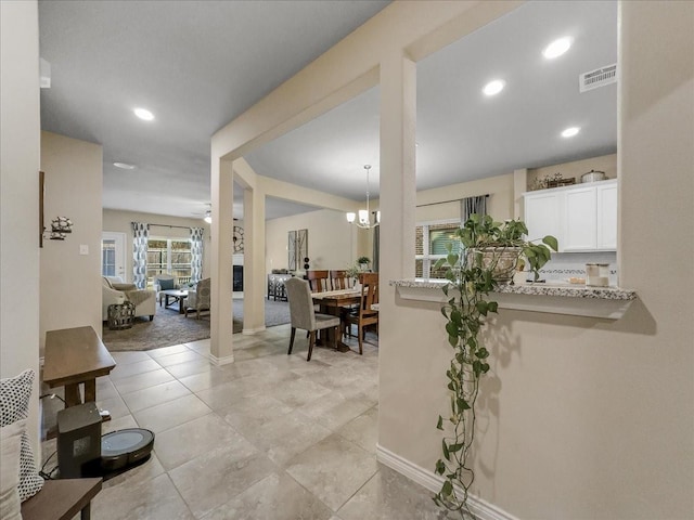 dining room featuring ceiling fan with notable chandelier, baseboards, visible vents, and recessed lighting