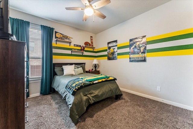 bedroom with a ceiling fan, baseboards, and carpet flooring