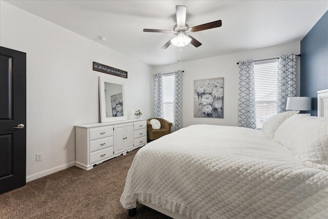 bedroom featuring a ceiling fan, dark colored carpet, and baseboards