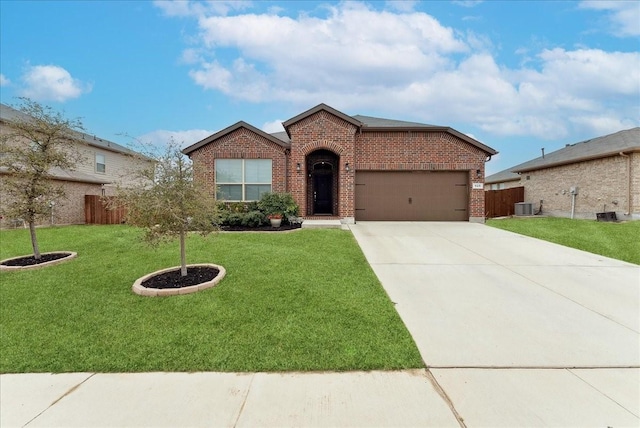 ranch-style home featuring a garage, brick siding, a front lawn, and central AC unit