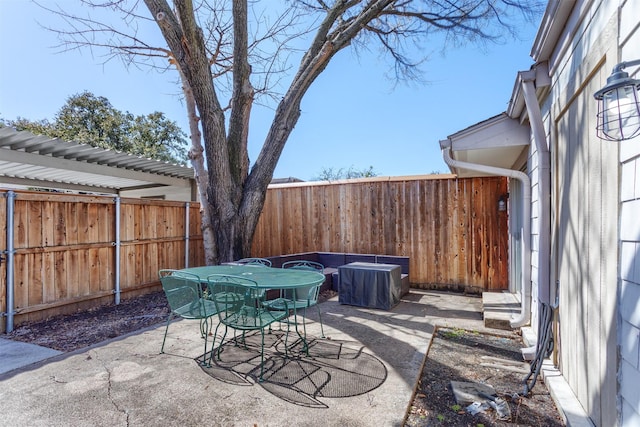 view of patio / terrace with a fenced backyard and outdoor dining area