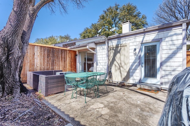 view of patio / terrace with outdoor dining area and fence