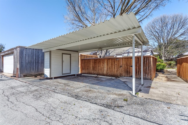 view of parking featuring fence