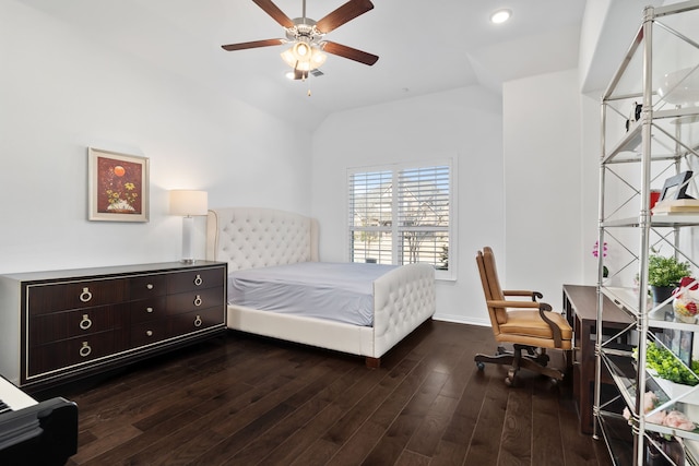 bedroom featuring dark wood-type flooring, a ceiling fan, baseboards, and vaulted ceiling