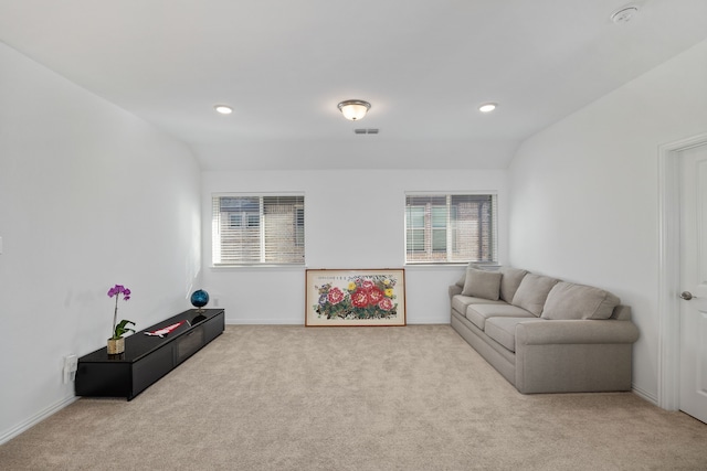 carpeted living room with recessed lighting, visible vents, and lofted ceiling