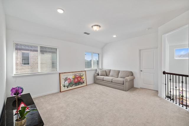 living room with visible vents, recessed lighting, baseboards, carpet flooring, and lofted ceiling