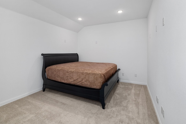 bedroom with recessed lighting, light colored carpet, and baseboards