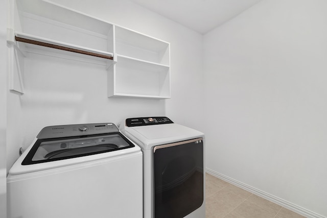 laundry room featuring washer and dryer, laundry area, and baseboards