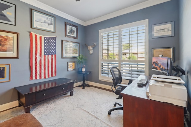 office space with crown molding and baseboards