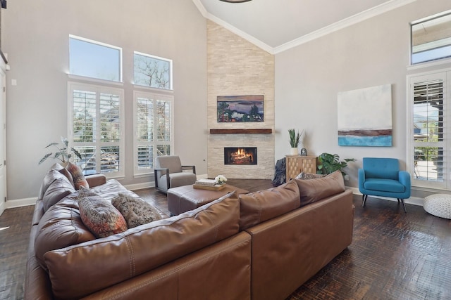 living area with baseboards, high vaulted ceiling, a stone fireplace, and ornamental molding