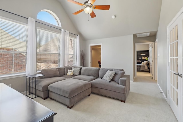 living room featuring light carpet, visible vents, baseboards, ceiling fan, and vaulted ceiling