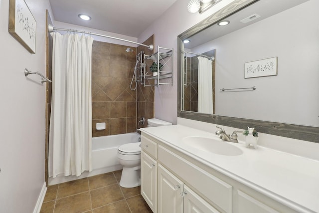 full bath with tile patterned flooring, toilet, vanity, visible vents, and shower / bath combination with curtain