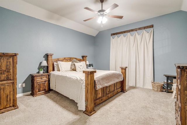 bedroom featuring vaulted ceiling, ceiling fan, visible vents, and light colored carpet