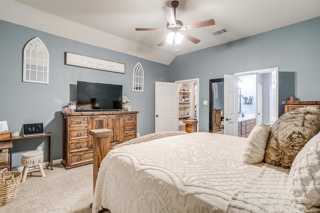 carpeted bedroom with visible vents, vaulted ceiling, baseboards, and ceiling fan