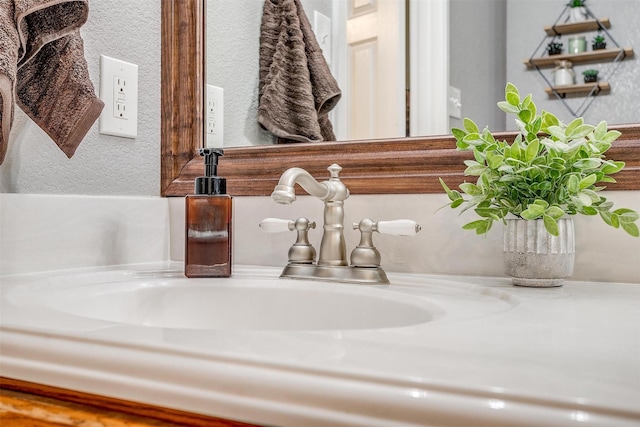 room details with a textured wall and a sink