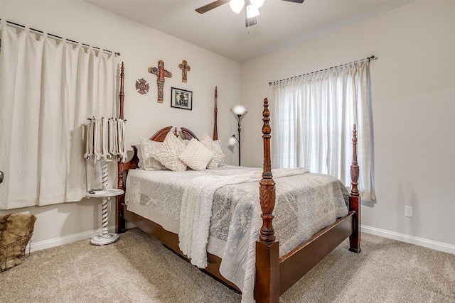 bedroom featuring ceiling fan, carpet, and baseboards