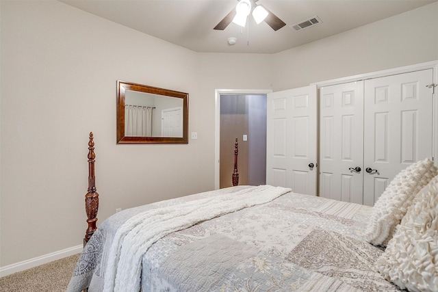 bedroom featuring baseboards, visible vents, a ceiling fan, carpet floors, and a closet