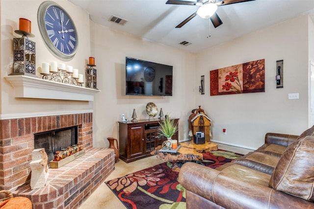 carpeted living area with a brick fireplace, visible vents, ceiling fan, and baseboards