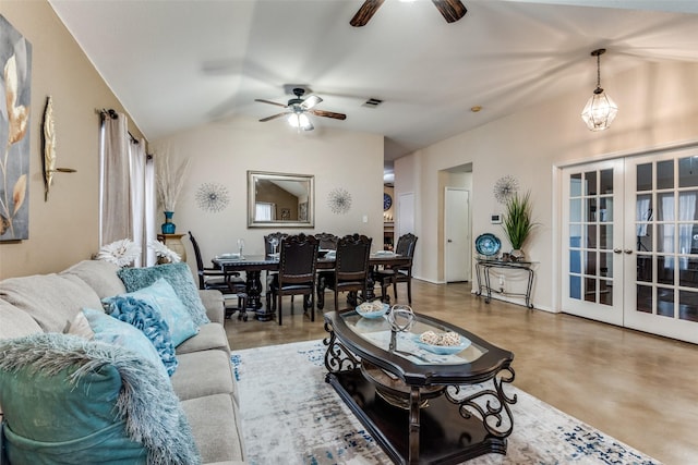 living area with french doors, visible vents, vaulted ceiling, ceiling fan, and concrete floors