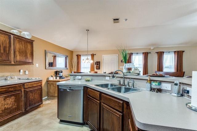 kitchen with visible vents, dishwasher, decorative light fixtures, light countertops, and a sink