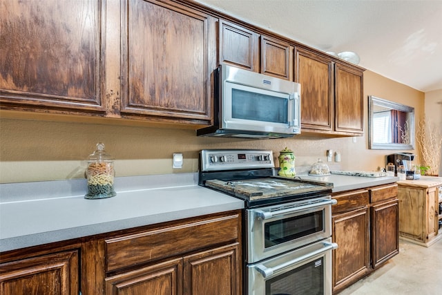 kitchen featuring appliances with stainless steel finishes and light countertops