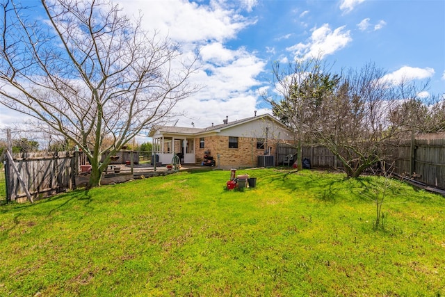 view of yard featuring a patio, a fenced backyard, and central air condition unit