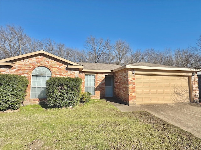 ranch-style home with a front yard, brick siding, driveway, and an attached garage