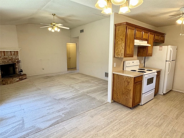 kitchen featuring a ceiling fan, white appliances, brown cabinets, and under cabinet range hood