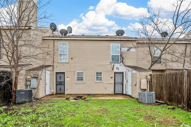 back of house with a patio area, fence, cooling unit, and a yard