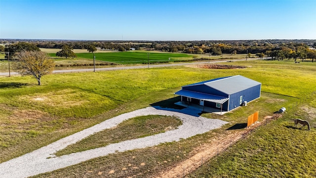 birds eye view of property featuring a rural view