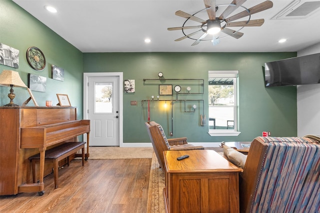 home office with a ceiling fan, recessed lighting, visible vents, and wood finished floors