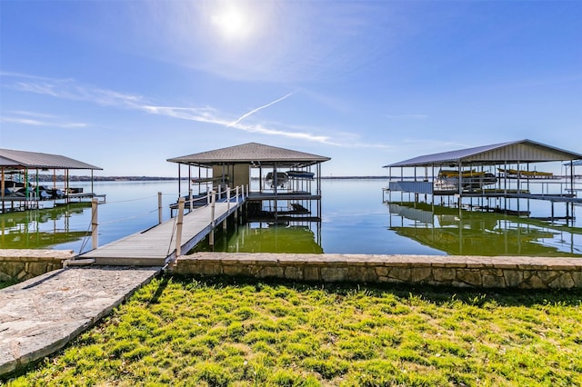 dock area with a water view and boat lift