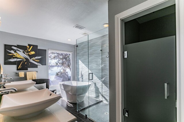 full bathroom with tile walls, a soaking tub, visible vents, a shower stall, and tile patterned floors