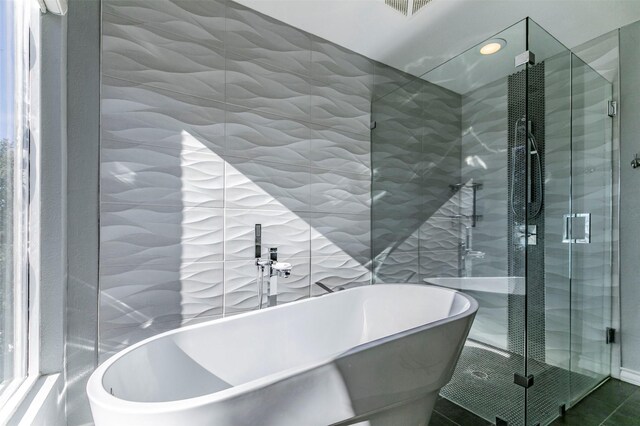 full bathroom with double vanity, visible vents, and a sink