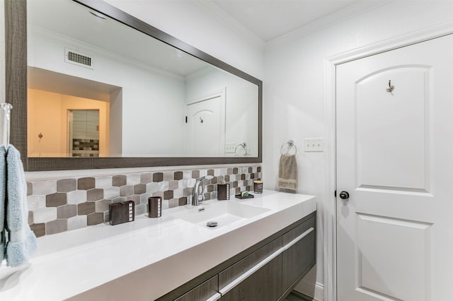 bathroom featuring tasteful backsplash, visible vents, ornamental molding, and vanity