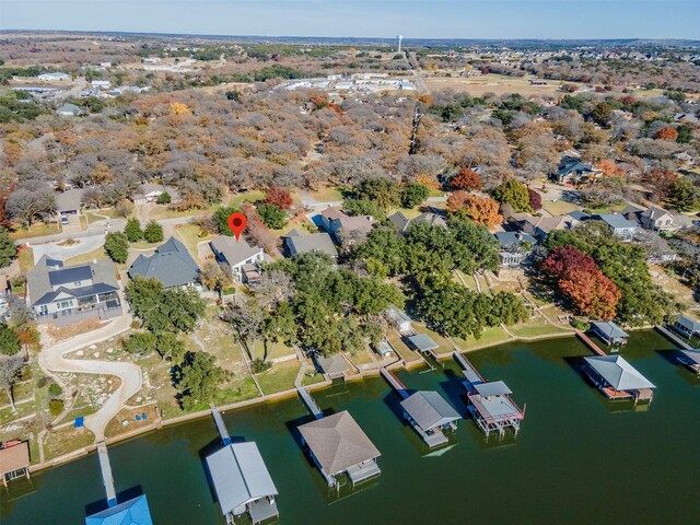 birds eye view of property featuring a residential view and a water view