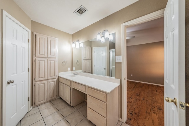 full bathroom with vanity, visible vents, and tile patterned floors