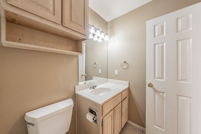 bathroom with toilet and vanity