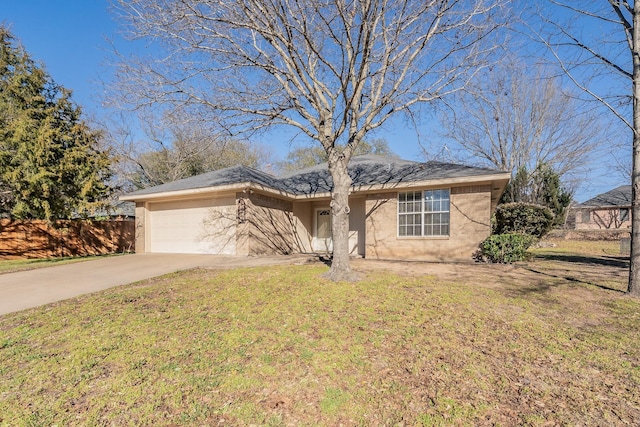 single story home featuring a garage, a front yard, and concrete driveway