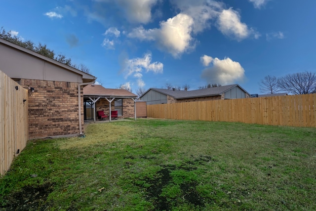 view of yard featuring a fenced backyard