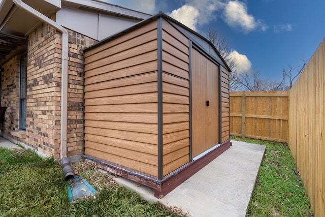 view of shed featuring a fenced backyard