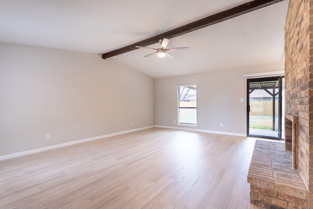 empty room with light wood-style floors, vaulted ceiling with beams, baseboards, and ceiling fan