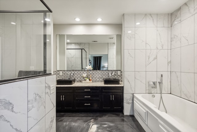 full bathroom featuring a bath, an enclosed shower, vanity, tile walls, and recessed lighting