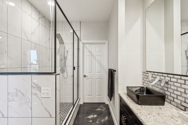 bathroom featuring a stall shower, backsplash, and vanity